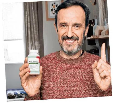 Manufacturer promotional photo of a man holding a ProDentim bottle
